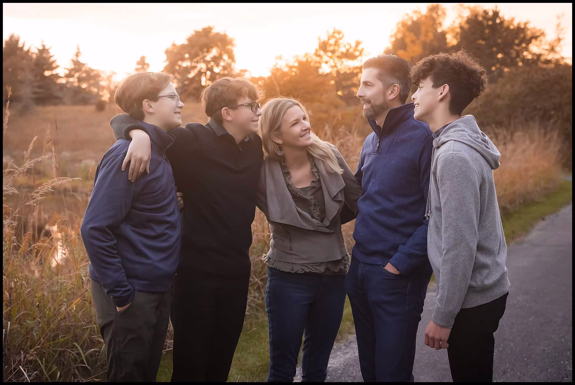 Family photo taken at sunset with a mom, dad and their 3 high school age children. This shoot took place in Vernon Hills, IL